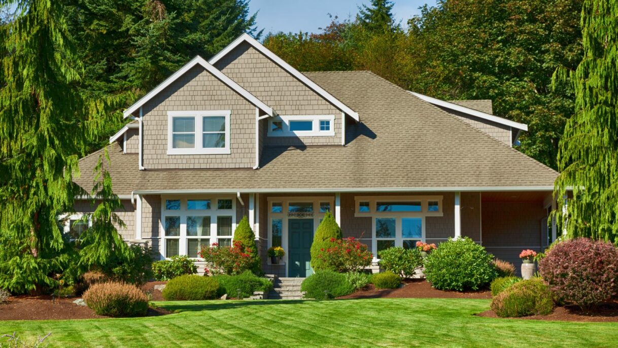A charming rural house surrounded by nature, featuring a well-maintained roof, windows, and exterior. Empire Contractors LLC provides expert roofing, window, and gutter services in Cincinnati, OH, and surrounding areas to keep homes protected and beautiful.