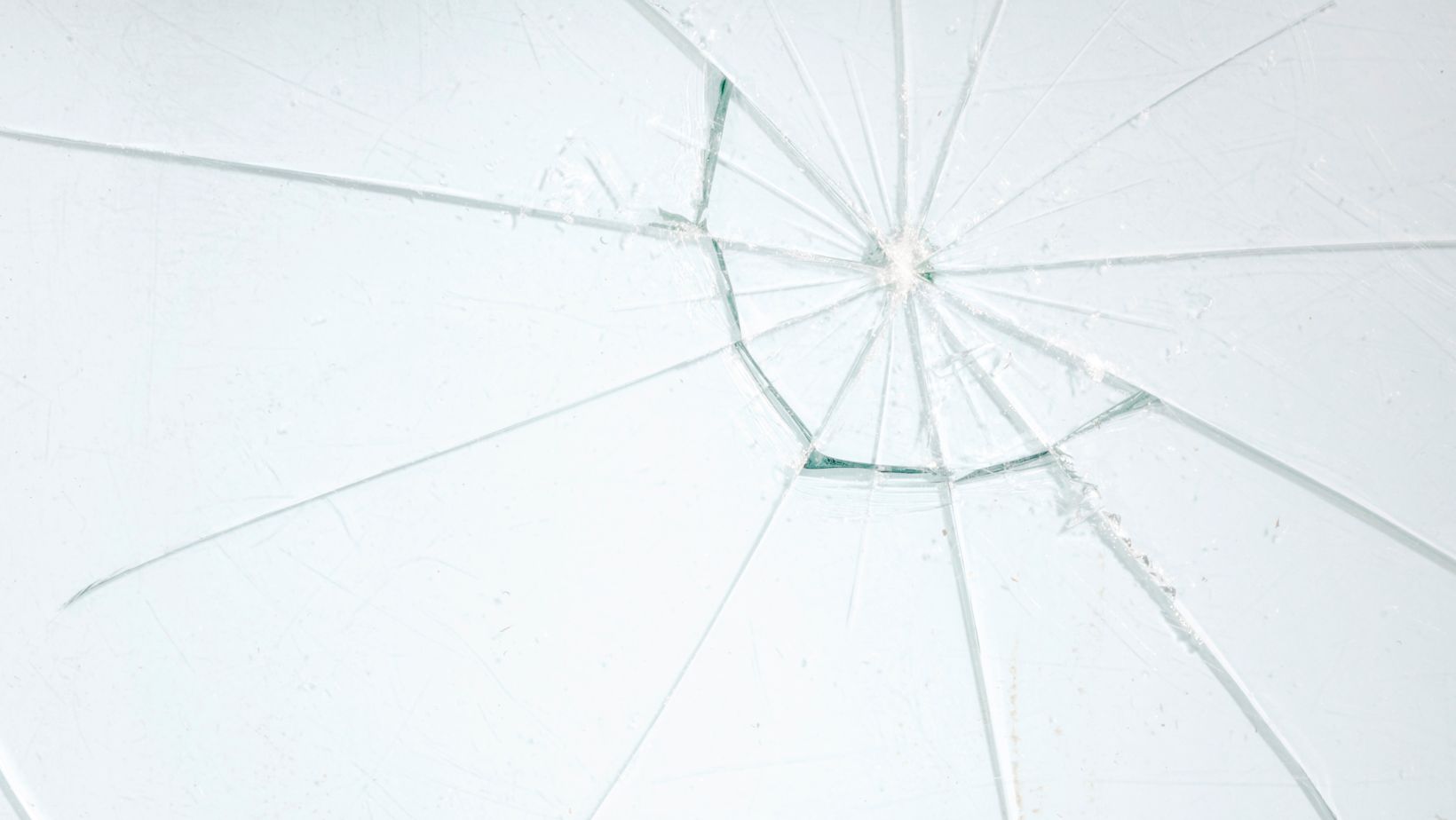 Close-up of a cracked residential window, highlighting the need for repair or replacement. Empire Contractors LLC provides professional window repair and installation services in Cincinnati, OH, and surrounding areas.
