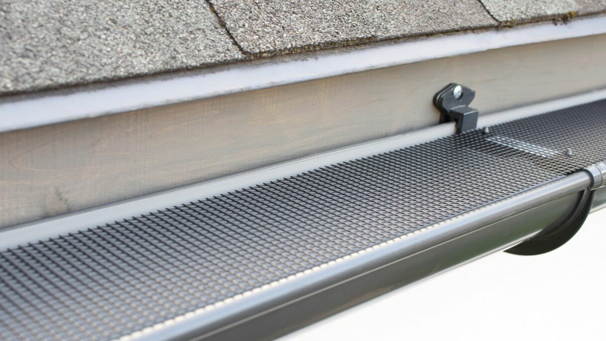 Close-up of a professional gutter cleaning system in action, removing leaves and debris from a residential gutter. Empire Contractors LLC offers expert gutter cleaning and maintenance services in Cincinnati, OH, and surrounding areas to protect homes from water damage.