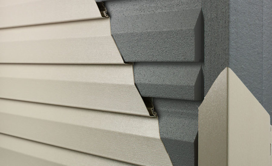 Close-up of insulated vinyl siding with a cutaway view showing foam backing for enhanced energy efficiency and durability. Insulated siding improves home insulation, reduces energy costs, and enhances curb appeal. Empire Contractors specializes in high-quality siding installation for long-lasting protection.